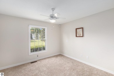 Welcome to easy living in the heart of Elk Rapids! This charming on Elk Rapids Golf Club in Michigan - for sale on GolfHomes.com, golf home, golf lot