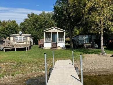 Two-bedroom one bath located on Roy Lake. 2009 14 x 55 mobile on Roy View Golf Course in South Dakota - for sale on GolfHomes.com, golf home, golf lot