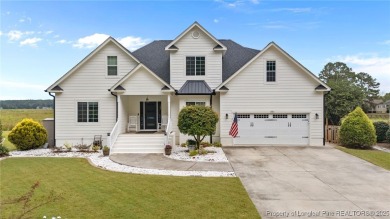 Discover this stunning home on a lakefront lot in the on Woodlake Country Club in North Carolina - for sale on GolfHomes.com, golf home, golf lot