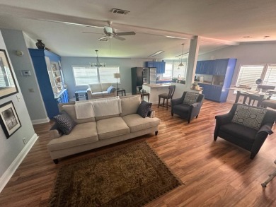 This well-loved 2-bedroom, 2-bathroom Palm Harbor home is being on Del Tura Golf and Country Club in Florida - for sale on GolfHomes.com, golf home, golf lot