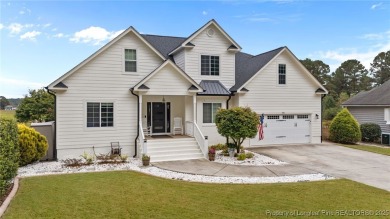Discover this stunning home on a lakefront lot in the on Woodlake Country Club in North Carolina - for sale on GolfHomes.com, golf home, golf lot
