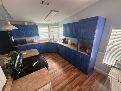 This well-loved 2-bedroom, 2-bathroom Palm Harbor home is being on Del Tura Golf and Country Club in Florida - for sale on GolfHomes.com, golf home, golf lot