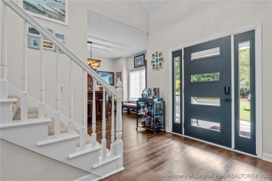 Discover this stunning home on a lakefront lot in the on Woodlake Country Club in North Carolina - for sale on GolfHomes.com, golf home, golf lot