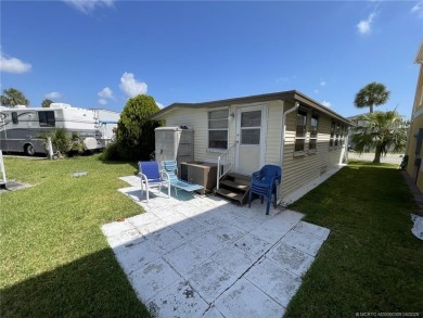 Step into coastal comfort with this 2 bedroom, 1 bathroom on Island Dunes Country Club in Florida - for sale on GolfHomes.com, golf home, golf lot
