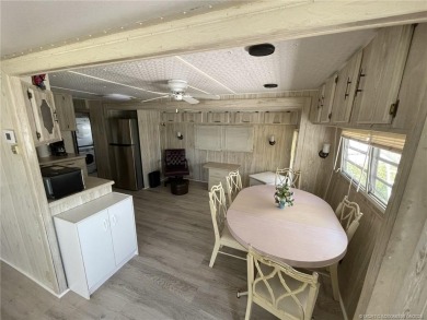 Step into coastal comfort with this 2 bedroom, 1 bathroom on Island Dunes Country Club in Florida - for sale on GolfHomes.com, golf home, golf lot
