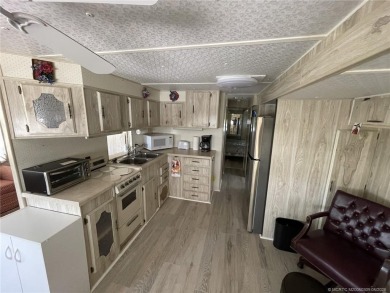 Step into coastal comfort with this 2 bedroom, 1 bathroom on Island Dunes Country Club in Florida - for sale on GolfHomes.com, golf home, golf lot
