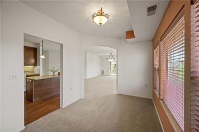 Welcome to this sun-drenched corner unit overlooking the serene on Edinburgh USA in Minnesota - for sale on GolfHomes.com, golf home, golf lot