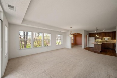 Welcome to this sun-drenched corner unit overlooking the serene on Edinburgh USA in Minnesota - for sale on GolfHomes.com, golf home, golf lot