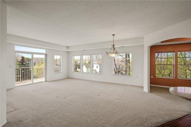 Welcome to this sun-drenched corner unit overlooking the serene on Edinburgh USA in Minnesota - for sale on GolfHomes.com, golf home, golf lot