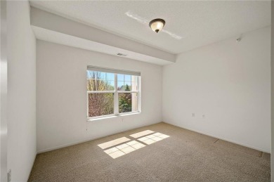 Welcome to this sun-drenched corner unit overlooking the serene on Edinburgh USA in Minnesota - for sale on GolfHomes.com, golf home, golf lot