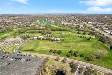 Welcome to this sun-drenched corner unit overlooking the serene on Edinburgh USA in Minnesota - for sale on GolfHomes.com, golf home, golf lot