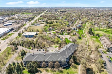 Welcome to this sun-drenched corner unit overlooking the serene on Edinburgh USA in Minnesota - for sale on GolfHomes.com, golf home, golf lot