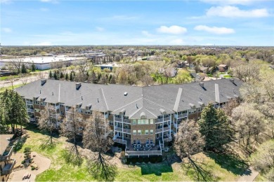 Welcome to this sun-drenched corner unit overlooking the serene on Edinburgh USA in Minnesota - for sale on GolfHomes.com, golf home, golf lot