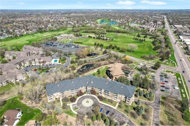 Welcome to this sun-drenched corner unit overlooking the serene on Edinburgh USA in Minnesota - for sale on GolfHomes.com, golf home, golf lot