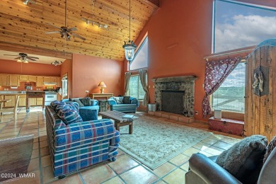 Enjoy the rustic cabin feel of this home after a day of fun on Silver Creek Golf Club in Arizona - for sale on GolfHomes.com, golf home, golf lot