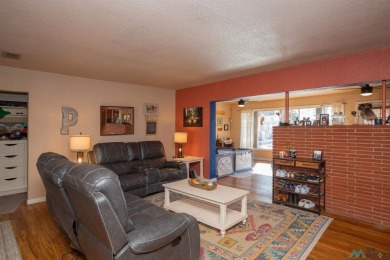 Cheerful, warm and inviting, this unique home is brimming with on Spring River Golf Course in New Mexico - for sale on GolfHomes.com, golf home, golf lot