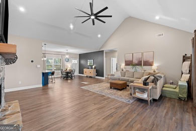 Tucked away just steps from Jackson Lake, this beautifully on Turtle Cove Golf Course in Georgia - for sale on GolfHomes.com, golf home, golf lot