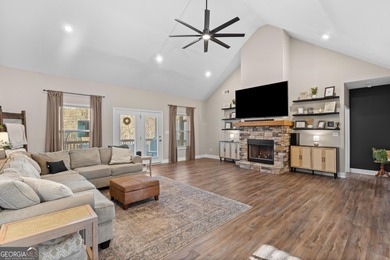 Tucked away just steps from Jackson Lake, this beautifully on Turtle Cove Golf Course in Georgia - for sale on GolfHomes.com, golf home, golf lot