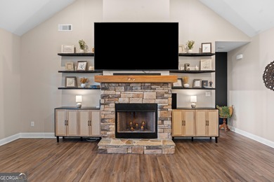 Tucked away just steps from Jackson Lake, this beautifully on Turtle Cove Golf Course in Georgia - for sale on GolfHomes.com, golf home, golf lot