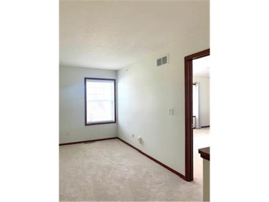 Multi-level walkout townhome with mature pine tree privacy on Deer Run Golf Club in Minnesota - for sale on GolfHomes.com, golf home, golf lot