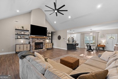 Tucked away just steps from Jackson Lake, this beautifully on Turtle Cove Golf Course in Georgia - for sale on GolfHomes.com, golf home, golf lot