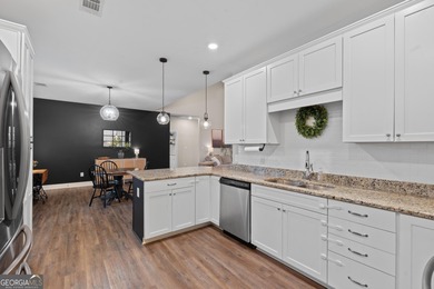 Tucked away just steps from Jackson Lake, this beautifully on Turtle Cove Golf Course in Georgia - for sale on GolfHomes.com, golf home, golf lot