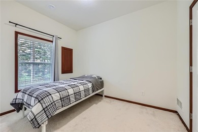 Multi-level walkout townhome with mature pine tree privacy on Deer Run Golf Club in Minnesota - for sale on GolfHomes.com, golf home, golf lot