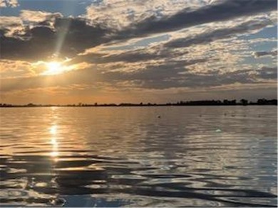 Multi-level walkout townhome with mature pine tree privacy on Deer Run Golf Club in Minnesota - for sale on GolfHomes.com, golf home, golf lot