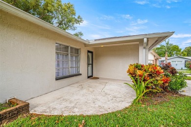 Welcome home to this updated, move-in ready Palm Harbor retreat on Highland Lakes Executive Golf Course in Florida - for sale on GolfHomes.com, golf home, golf lot