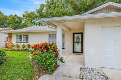 Welcome home to this updated, move-in ready Palm Harbor retreat on Highland Lakes Executive Golf Course in Florida - for sale on GolfHomes.com, golf home, golf lot