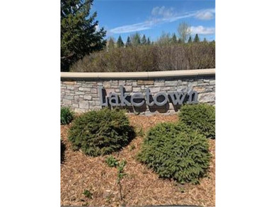 Multi-level walkout townhome with mature pine tree privacy on Deer Run Golf Club in Minnesota - for sale on GolfHomes.com, golf home, golf lot