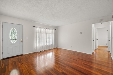 Welcome home to this updated, move-in ready Palm Harbor retreat on Highland Lakes Executive Golf Course in Florida - for sale on GolfHomes.com, golf home, golf lot