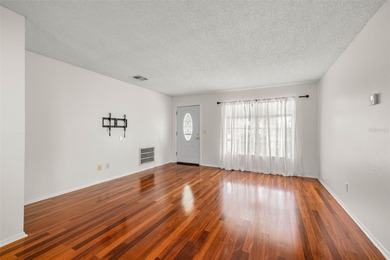 Welcome home to this updated, move-in ready Palm Harbor retreat on Highland Lakes Executive Golf Course in Florida - for sale on GolfHomes.com, golf home, golf lot