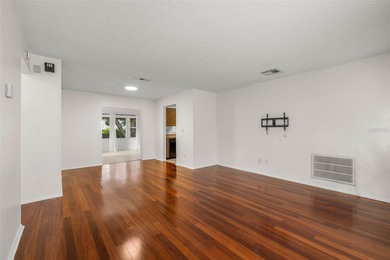 Welcome home to this updated, move-in ready Palm Harbor retreat on Highland Lakes Executive Golf Course in Florida - for sale on GolfHomes.com, golf home, golf lot