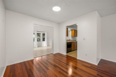 Welcome home to this updated, move-in ready Palm Harbor retreat on Highland Lakes Executive Golf Course in Florida - for sale on GolfHomes.com, golf home, golf lot