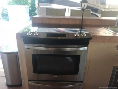 Nestled in the prestigious *millionaires row,* this magnificent on Motorcoach Resort Golf Course in Florida - for sale on GolfHomes.com, golf home, golf lot