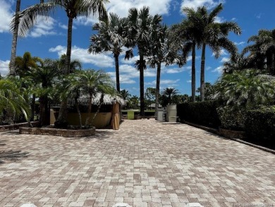 Nestled in the prestigious *millionaires row,* this magnificent on Motorcoach Resort Golf Course in Florida - for sale on GolfHomes.com, golf home, golf lot