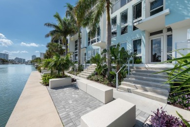This is a gorgeous 4-story townhome in the gated and exclusive on Normandy Shores Golf Course in Florida - for sale on GolfHomes.com, golf home, golf lot
