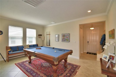 Located in the exclusive, gated community of ChampionsGate on The Oasis Club at Champions Gate in Florida - for sale on GolfHomes.com, golf home, golf lot