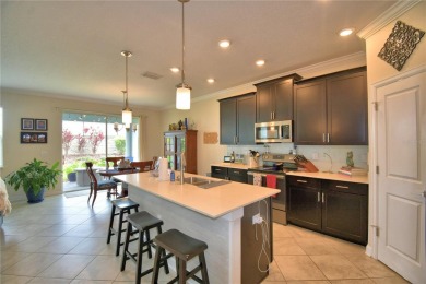 Located in the exclusive, gated community of ChampionsGate on The Oasis Club at Champions Gate in Florida - for sale on GolfHomes.com, golf home, golf lot