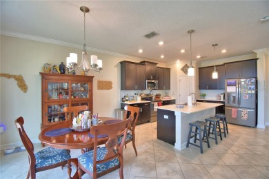 Located in the exclusive, gated community of ChampionsGate on The Oasis Club at Champions Gate in Florida - for sale on GolfHomes.com, golf home, golf lot