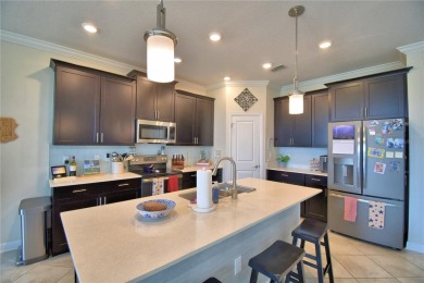 Located in the exclusive, gated community of ChampionsGate on The Oasis Club at Champions Gate in Florida - for sale on GolfHomes.com, golf home, golf lot