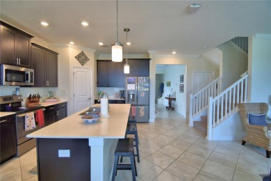 Located in the exclusive, gated community of ChampionsGate on The Oasis Club at Champions Gate in Florida - for sale on GolfHomes.com, golf home, golf lot