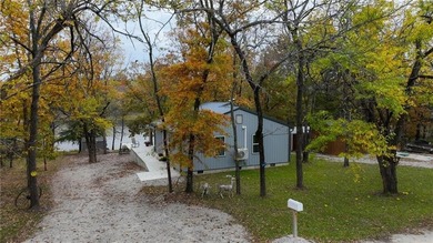 Price Improvement! Discover quiet lakefront living in this on Sugar Valley Lakes Golf Course in Kansas - for sale on GolfHomes.com, golf home, golf lot