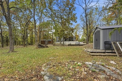 Price Improvement! Discover quiet lakefront living in this on Sugar Valley Lakes Golf Course in Kansas - for sale on GolfHomes.com, golf home, golf lot