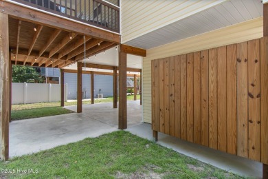 Welcome to 109 SW 17th Street, a beautiful home on pilings with on Founders Club At St. James Plantation in North Carolina - for sale on GolfHomes.com, golf home, golf lot