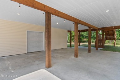 Welcome to 109 SW 17th Street, a beautiful home on pilings with on Founders Club At St. James Plantation in North Carolina - for sale on GolfHomes.com, golf home, golf lot