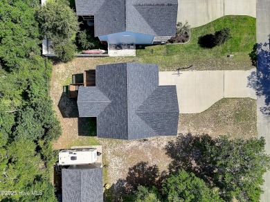Welcome to 109 SW 17th Street, a beautiful home on pilings with on Founders Club At St. James Plantation in North Carolina - for sale on GolfHomes.com, golf home, golf lot