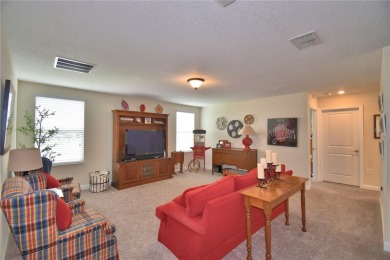 Located in the exclusive, gated community of ChampionsGate on The Oasis Club at Champions Gate in Florida - for sale on GolfHomes.com, golf home, golf lot