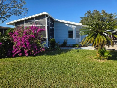 This well maintained 2/2 home is located on the golf course in on Lake Henry Golf Club in Florida - for sale on GolfHomes.com, golf home, golf lot